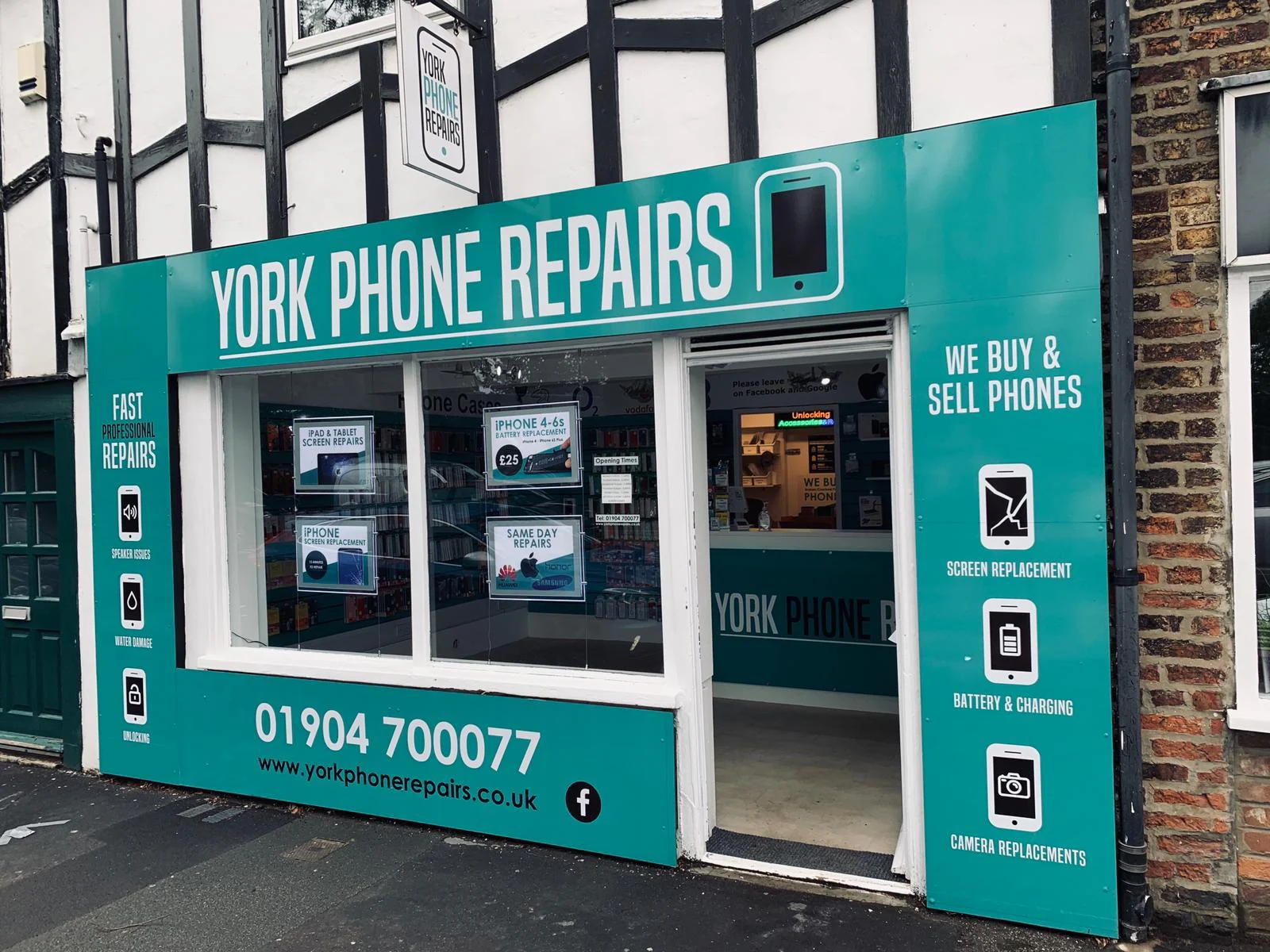 The teal York Phone Repairs shop sign on Tadcaster Road